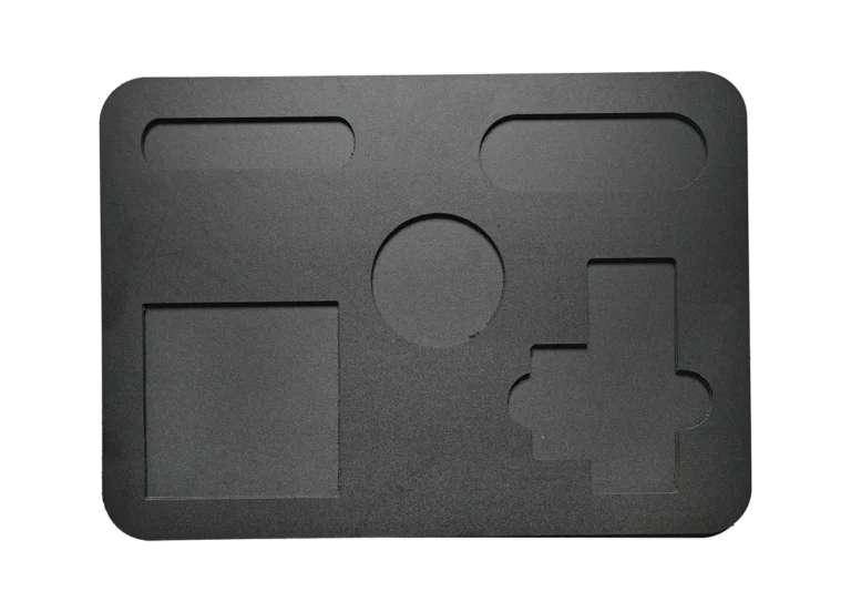 Layered plastic cutout pieces.